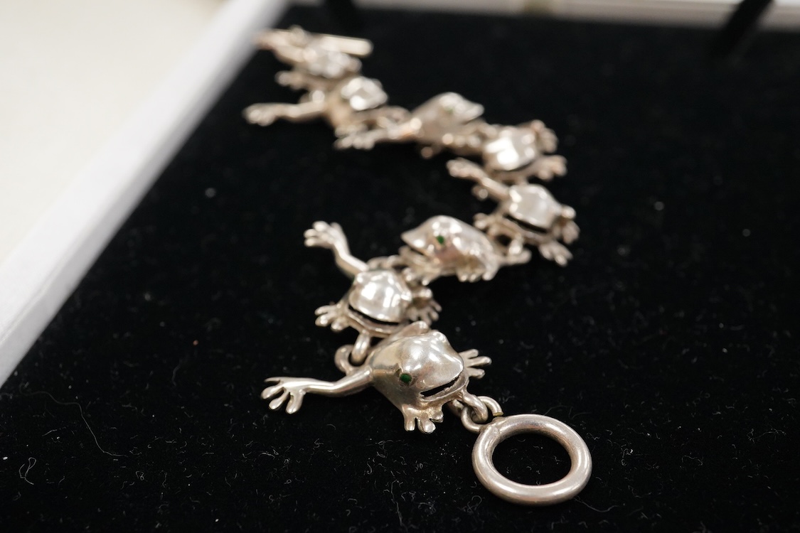 A recent white metal frog necklace, overall length 42cm and matching bracelet, 19cm, both stamped 925, gross 153 grams.